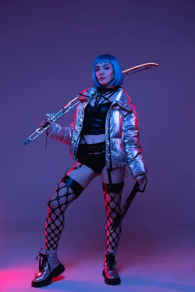Cyberpunk woman with sword in silver jacket — Stok fotoğraf