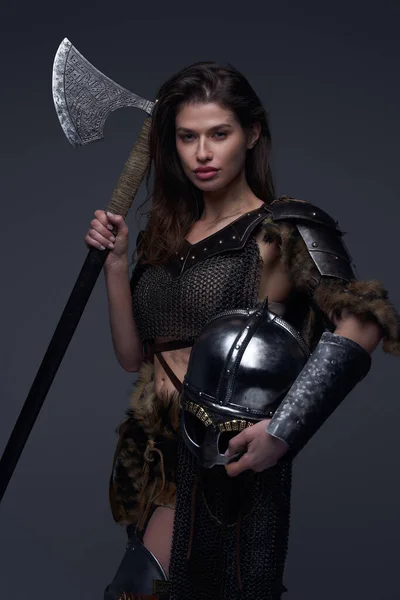 Armored northern woman with helmet and axe — Stock Photo, Image