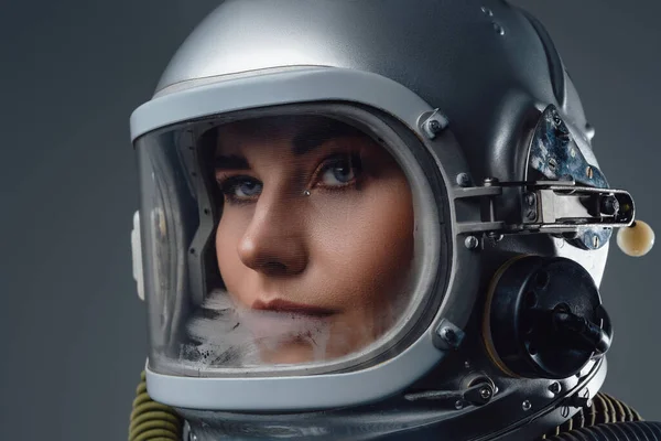 Headshot of modern spacewoman dressed in spacesuit — Stock Photo, Image