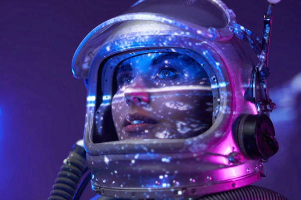 Studio portrait of spacewoman in shiny room — Stock Photo, Image
