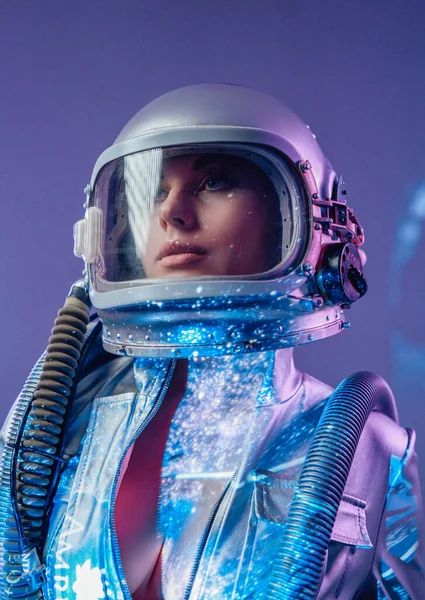 Spacewoman in helmet with open costume in starlight — Stock Photo, Image