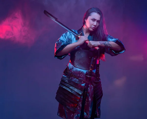 Oriental woman warrior in cyberpunk style with sword — Stock Photo, Image