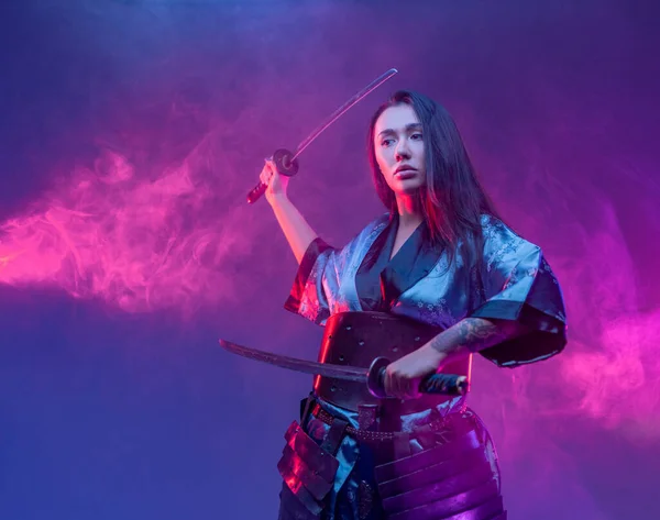 Cyberpunk style woman fighter with samurai swords — Stock Photo, Image