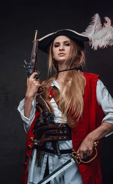 Female mercenary pirate with gun and sword — Stock Photo, Image