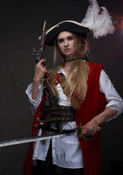 Female mercenary pirate with gun and sword — Stock Photo, Image