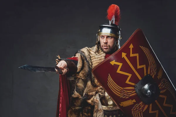 Roman general with shield pointing his sword — Stock Photo, Image