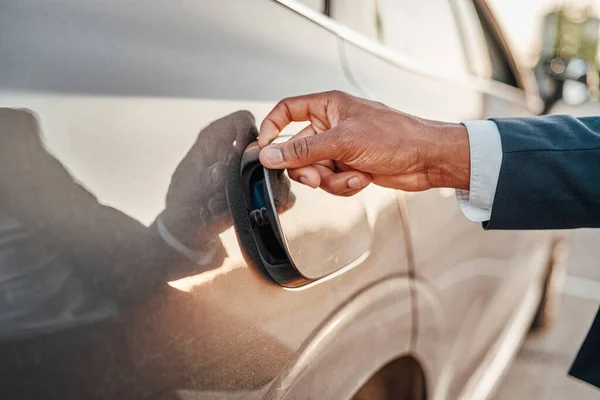 Shot of businessman opening fuel tank of his car — Stock Photo, Image