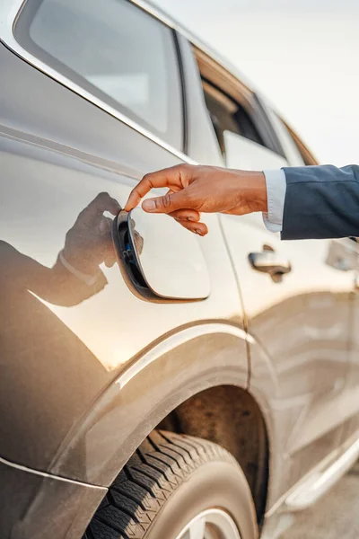Shot of human hand opening fuel tank of car — Stock Photo, Image