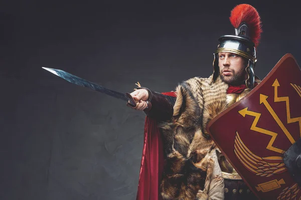 Roman general with shield pointing his sword — Stock Photo, Image