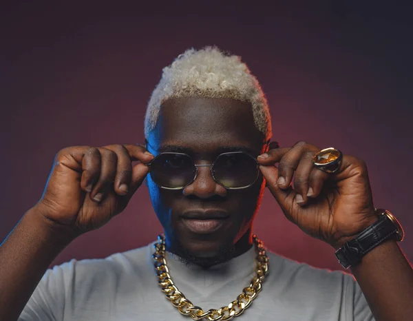 Black guy with gold sunglasses hot sale