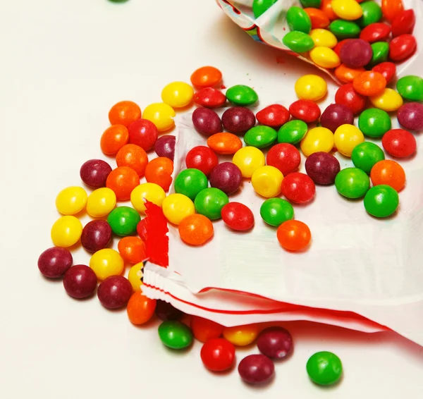 Openned pack which is full of skittles — Stock Photo, Image