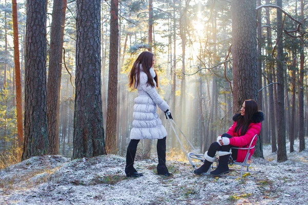 Two girls in winter forest. — Stock Photo, Image