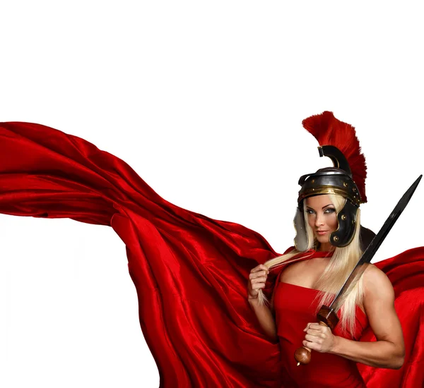 Blonde in a centurtion helmet and a red dress — Stock Photo, Image