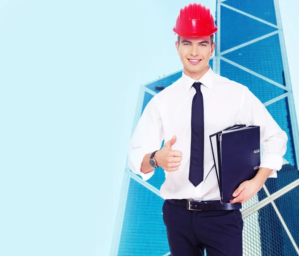 Successful young guy in a hardhat — Stock Photo, Image