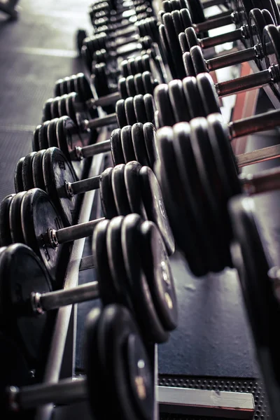Few heavy dumbbells in the gym — Stock Photo, Image