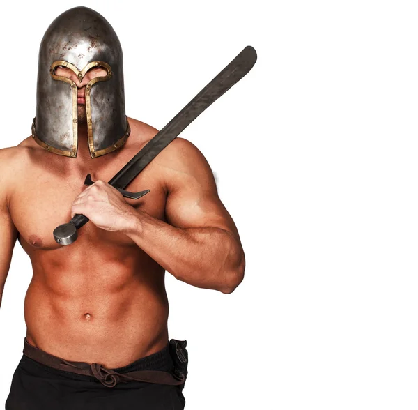 Shirtless warrior in helmet and with sword — Stock Photo, Image