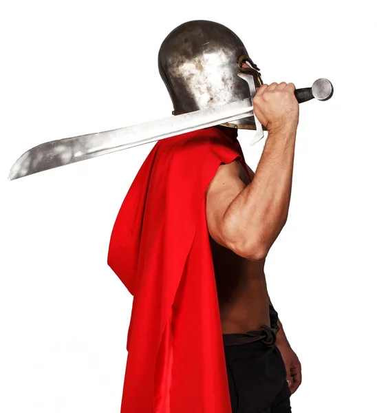 Sideview of shirtless warrior who is holding his sword — Stock Photo, Image