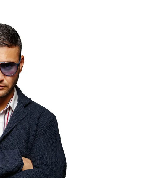 A serious guy in a blue cardigan — Stock Photo, Image