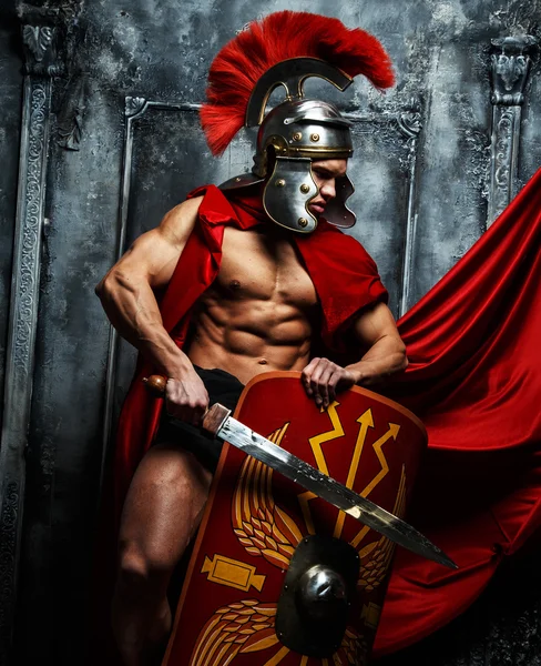 Roman warrior woth muscular body. — Stock Photo, Image