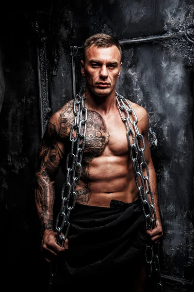 Muscular strong male with tattoo — Stock Photo, Image