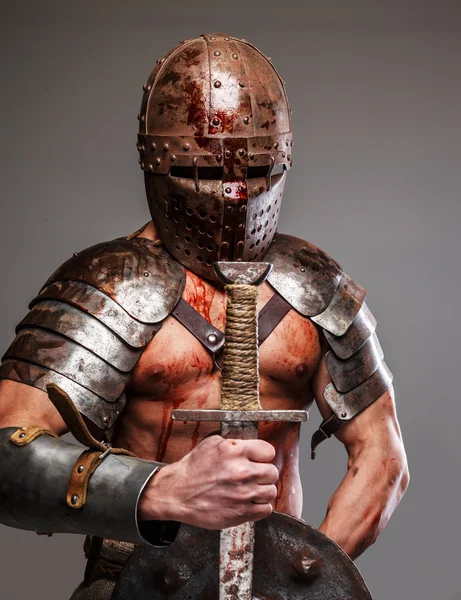 Gladiator holding shield and sword — Stock Photo, Image