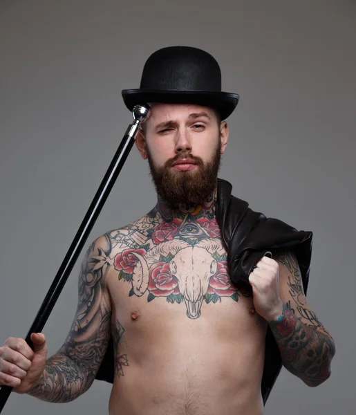 Naked tattooed male with cane — Stock Photo, Image