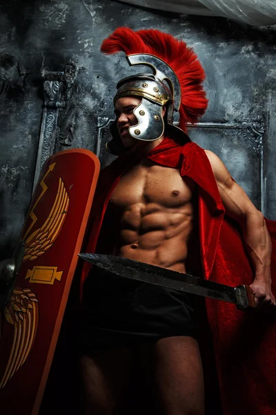 Roman muscular warrioir with sword and shield — Stock Photo, Image