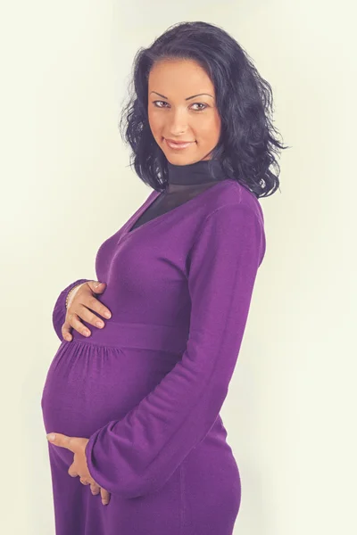 Beautiful lady in violet dress — Stock Photo, Image