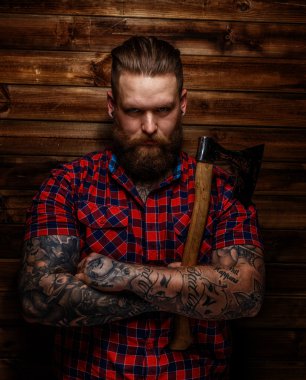 Strict brutal huge male with beard and axe clipart