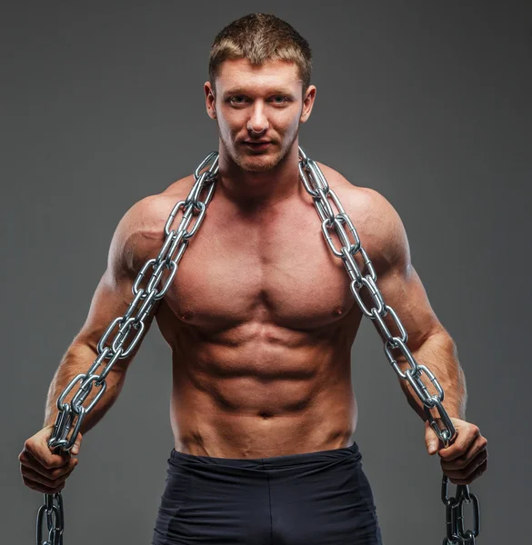 Big brutal musculed man showing his body — Stock Photo, Image