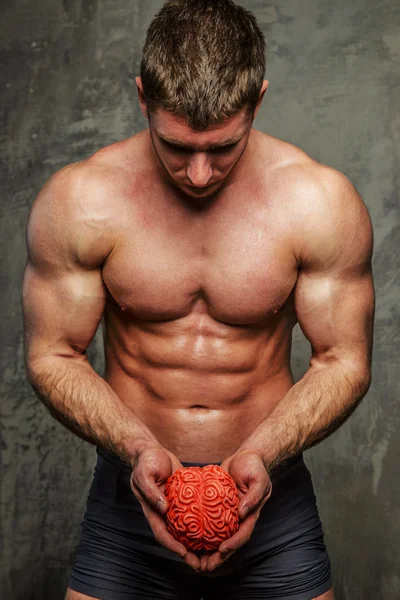 Muscular man on grey background. — Stock Photo, Image