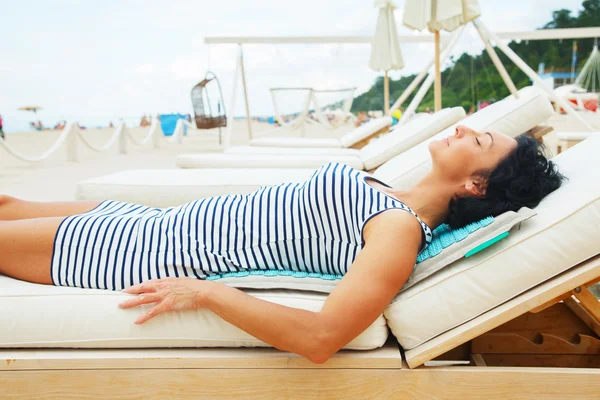 Middle age he on the beach sofa. — Stock Photo, Image