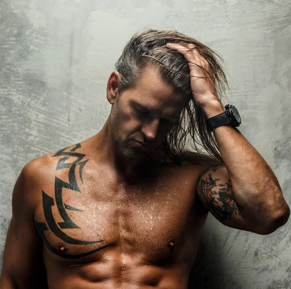 Portrait of stylish long-haired man. — Stock Photo, Image