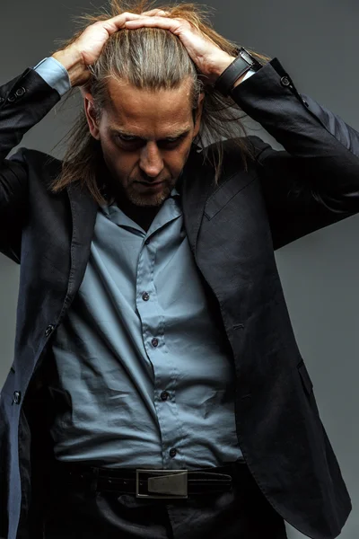 Portrait of stylish long-haired man. — Stock Photo, Image