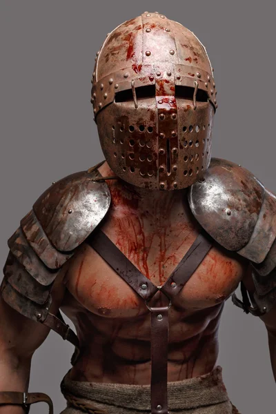 Gladiator in helmet with muscular body. — Stock Photo, Image