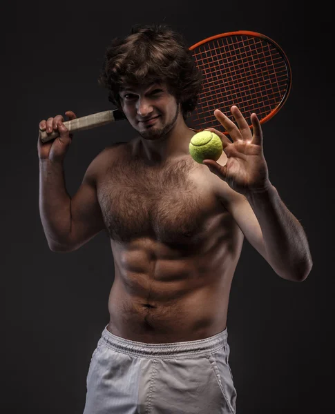 Male tennis player with racket. Stock Photo by ©fxquadro 66175731