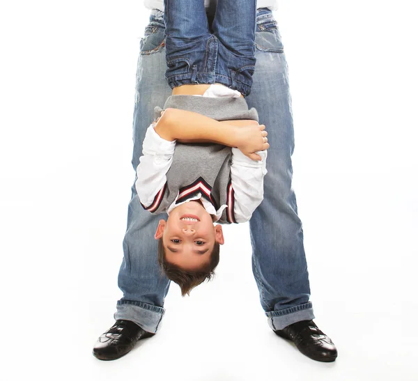 Man hands little boy headfirst — Stock Photo, Image