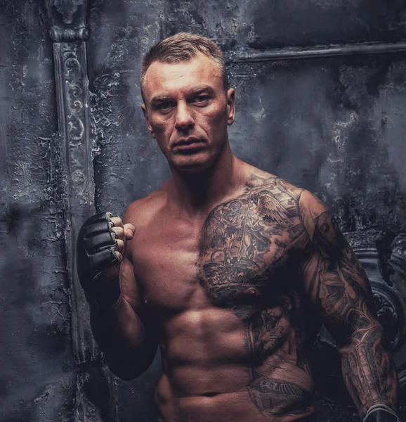 Muscular male with tattoos — Stock Photo, Image