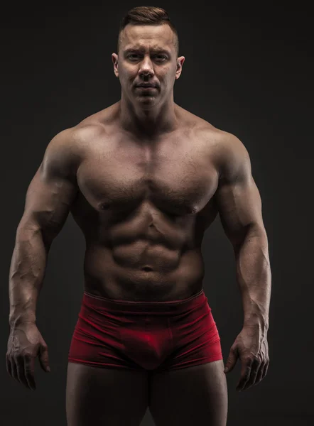 Muscular male in studio — Stock Photo, Image