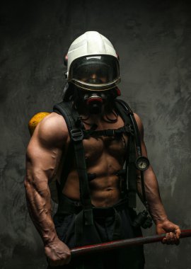 Muscular firefighter with axe clipart