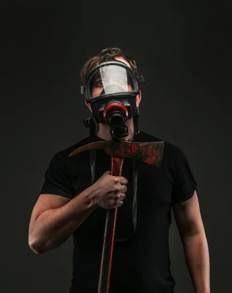 Male holds axe on grey background — Stock Photo, Image