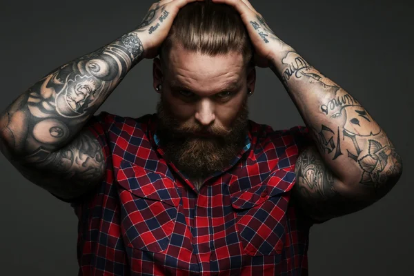 Male with tattoo on arms in studio — Stock Photo, Image