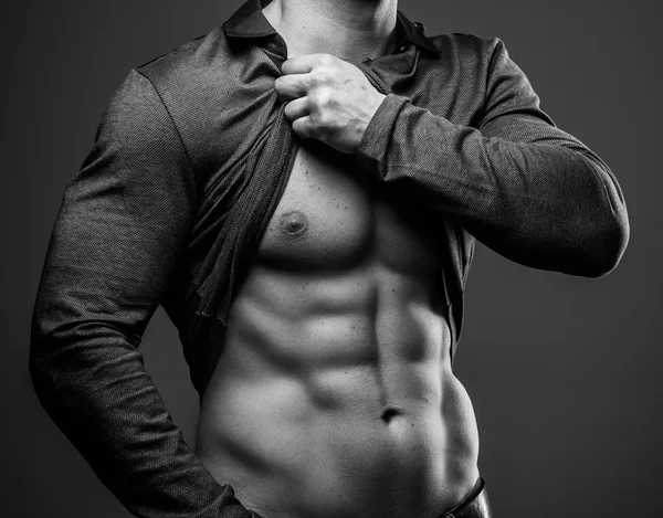 Fashionable guy with muscular body posing — Stock Photo, Image