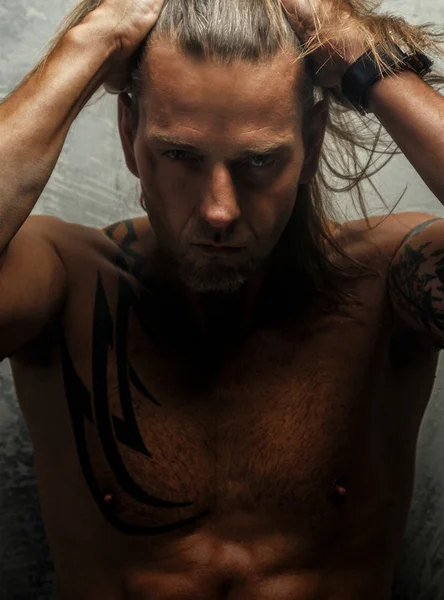 Portrait of stylish long-haired man. — Stock Photo, Image