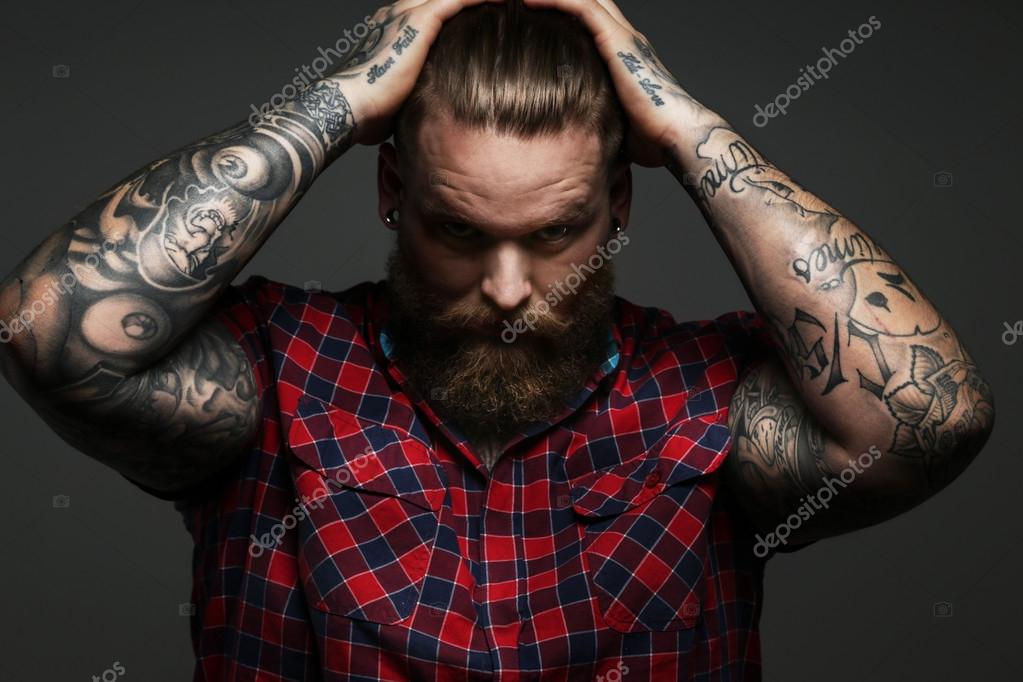 Male with tattoo on arms in studio Stock Photo by ©fxquadro 68915787