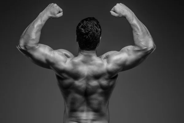 Bodybuilder posing in studio Royalty Free Stock Photos