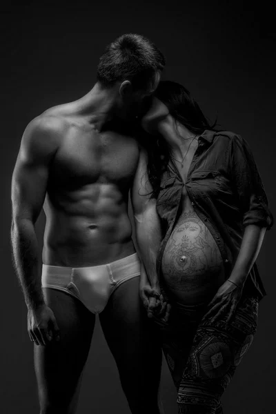 Naked man with his pregnant wife — Stock Photo, Image