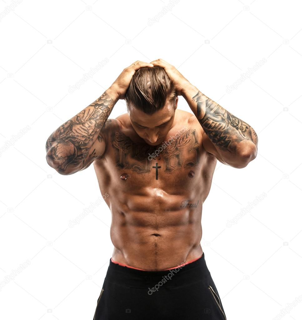 Muscular guy with tattooed body