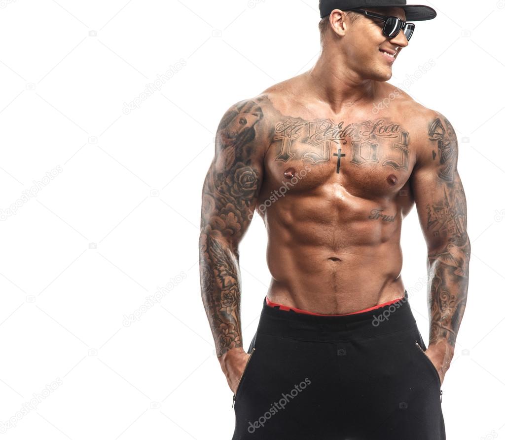 Brutal male with tattooed torso