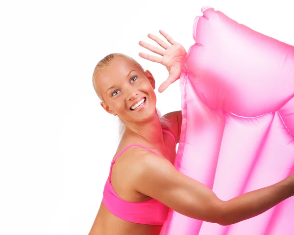 Happy blond woman with ater mattress — Stock Photo, Image